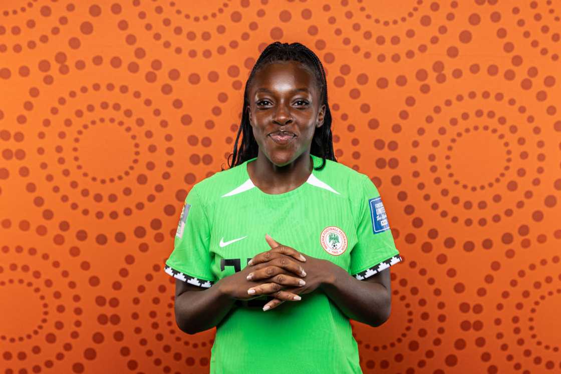 Michelle Alozie smiles while taking a photo before 2023 FIFA Women's World Cup