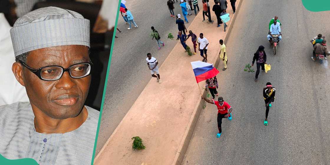 Former Director General, NIIA, Bola Akinterinwa and protesters waving Russian flag