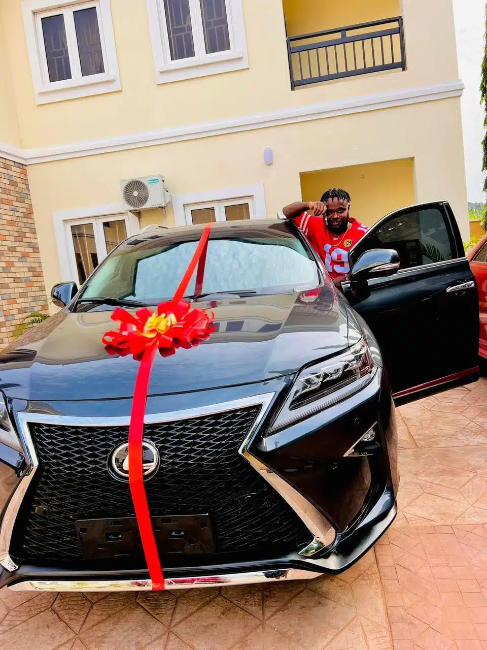 Nigerian woman expresses love for husband as she gifts him Lexus SUV for his birthday