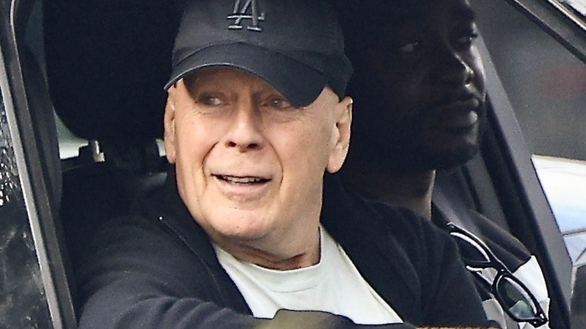 Bruce Willis, 69, makes rare public appearance on drive with his bodyguard amdi aphasia and dementia battle