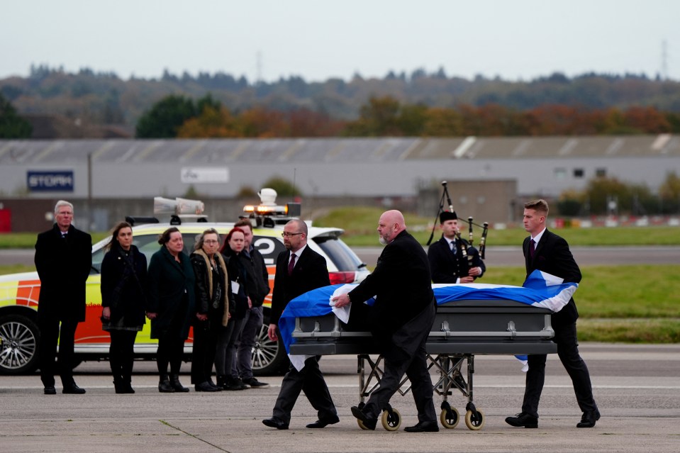 The former FM's Saltire-draped coffin landed in Aberdeen on a private plane