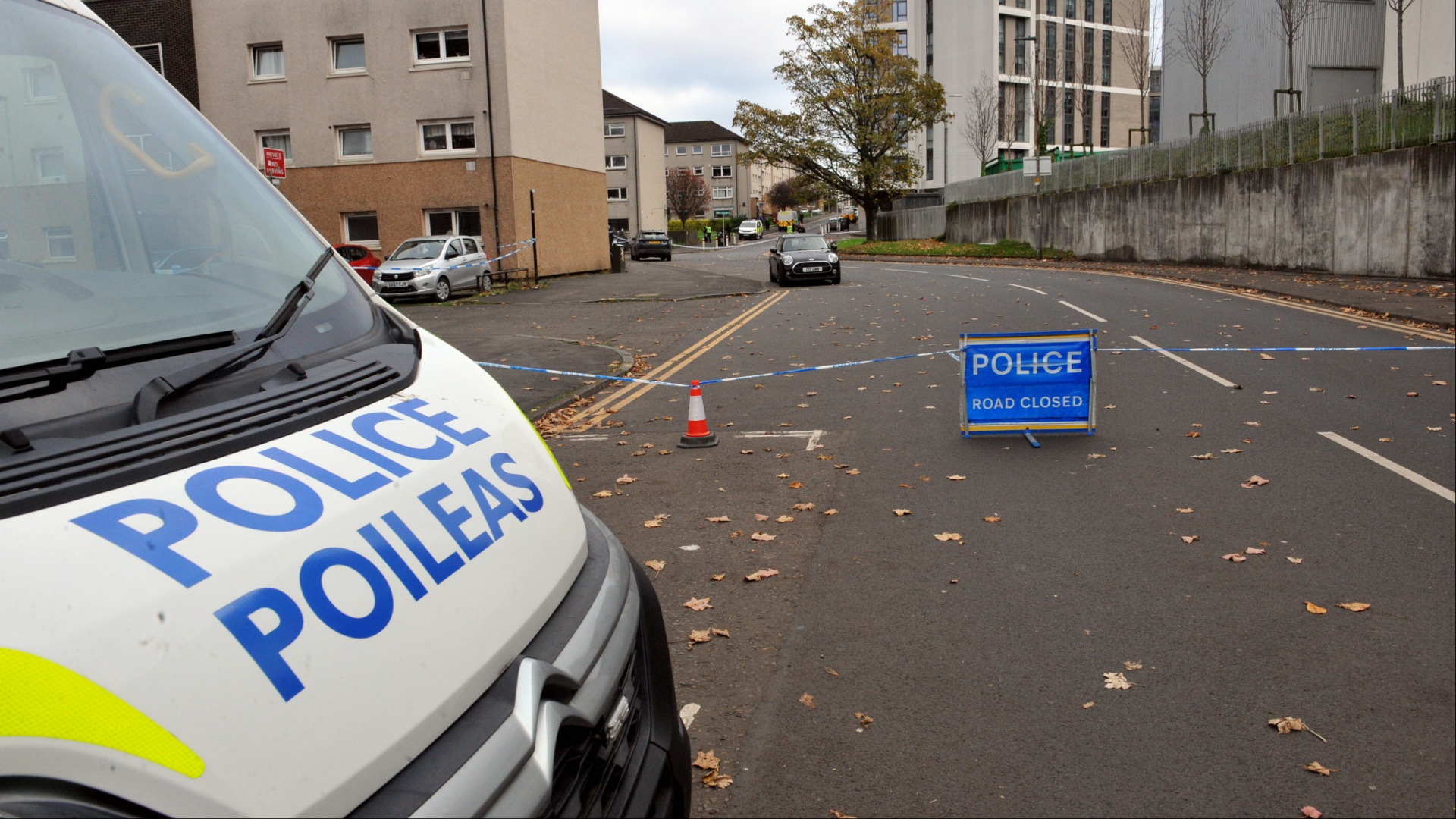 Cops launch murder probe after woman found dead in carpark of busy Scots housing estate as hundreds of homes locked down