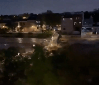 The Bridge collapses into the river sending up sprays of muddy water