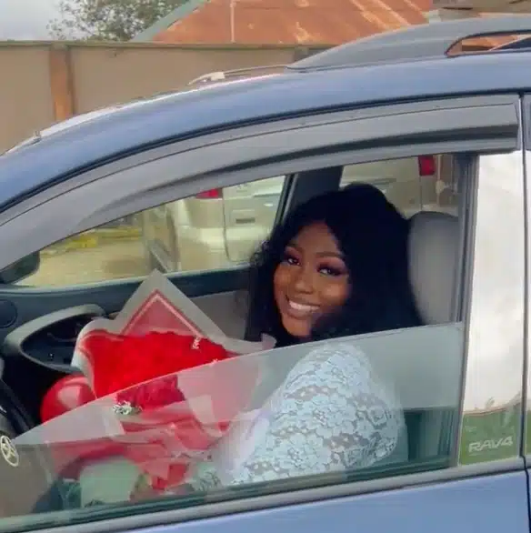 Lady celebrates becoming a car owner after praying for 10 months