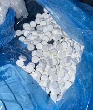 A bag packed with suspected street valium pills linked to the Scots gang