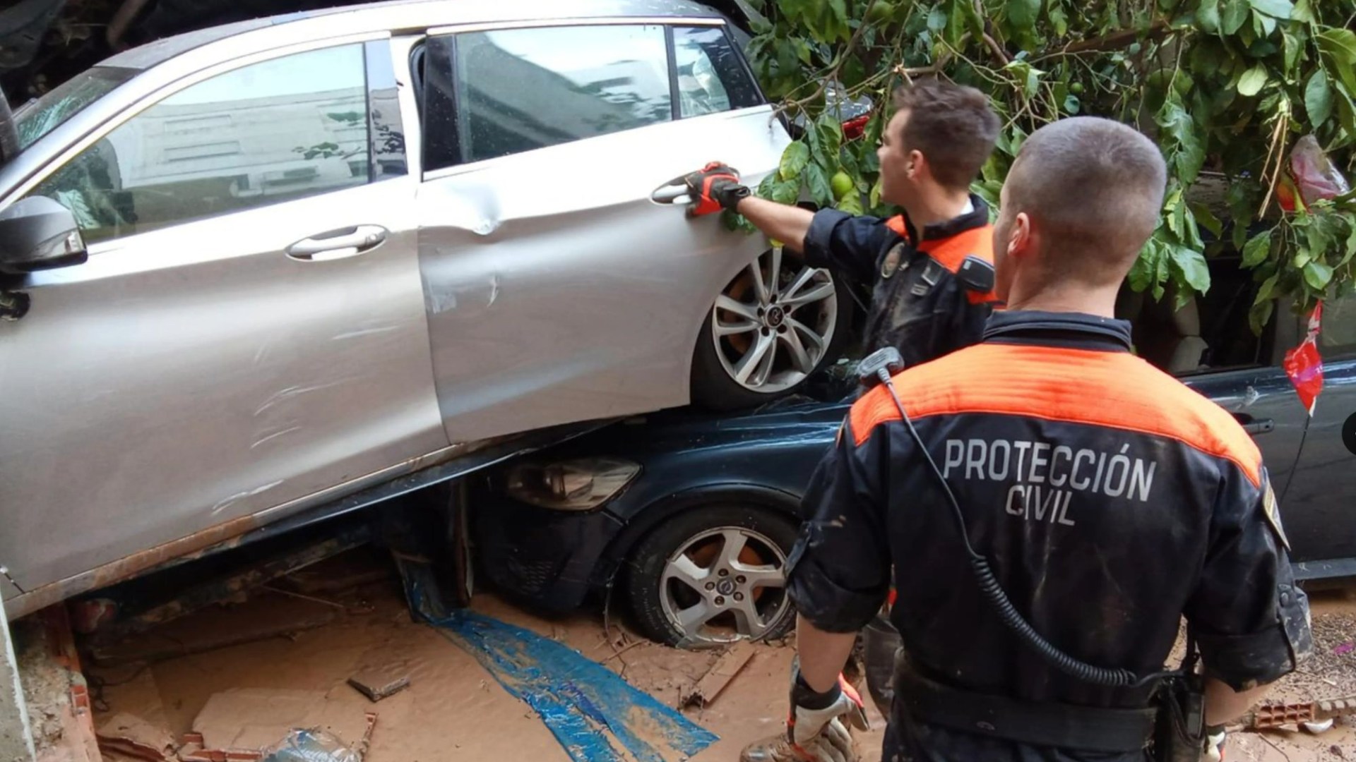 Woman found alive after 3 DAYS trapped in car with dead sister during Valencia floods as rescuers battle neck-high water