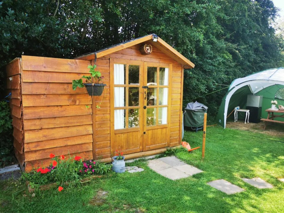 It has an outhouse bathroom with a gazebo area for relaxing outside