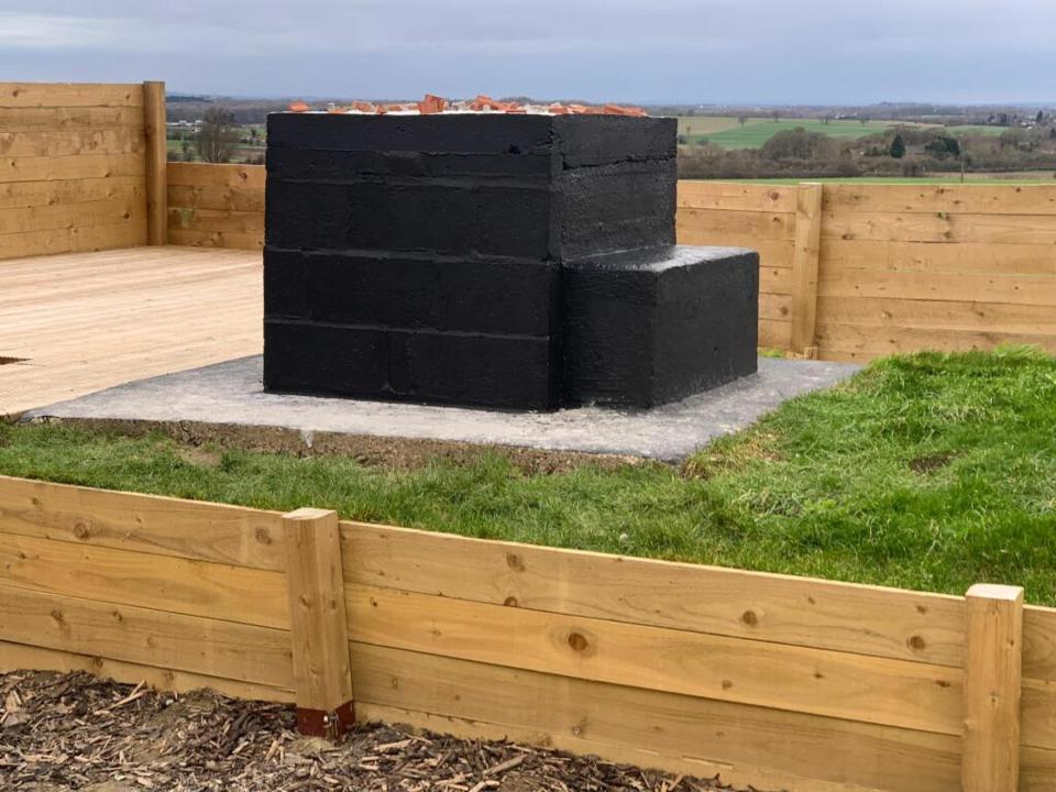 The bunker comes with its own gate and a fenced plot of land with decking and some outstanding views