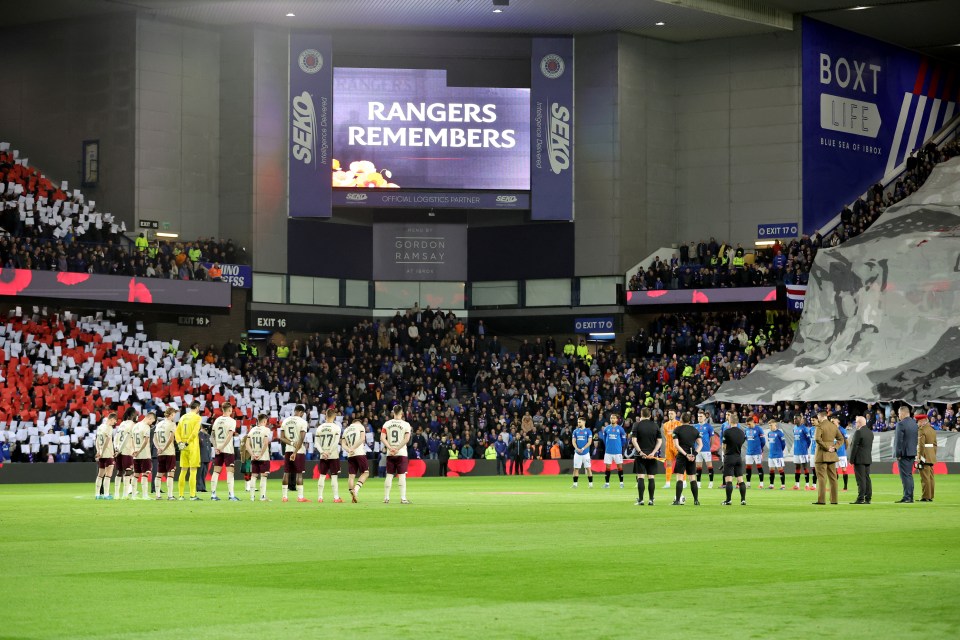 Both teams during a minute’s silence to mark Remembrance Day