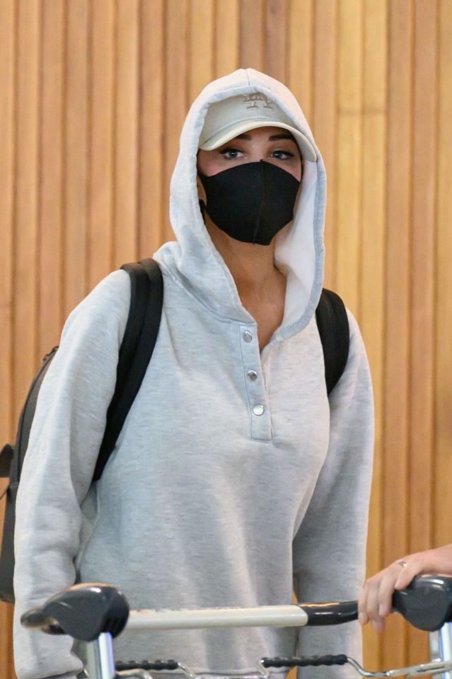 Only her eyes were visible through the hoodie and face mask