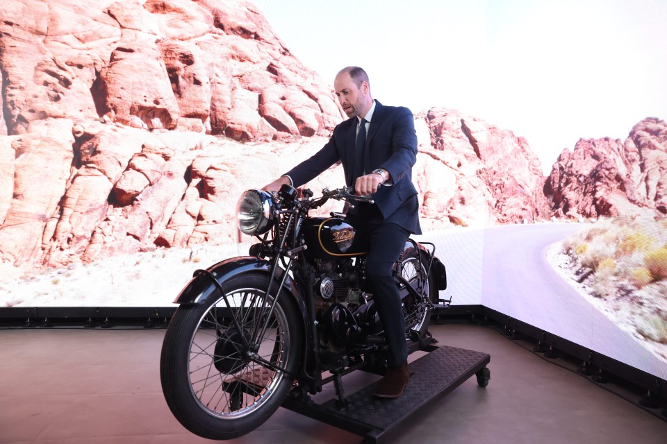 The Prince, who loves motorbikes, hopped on a simulator at Ulster University, Belfast