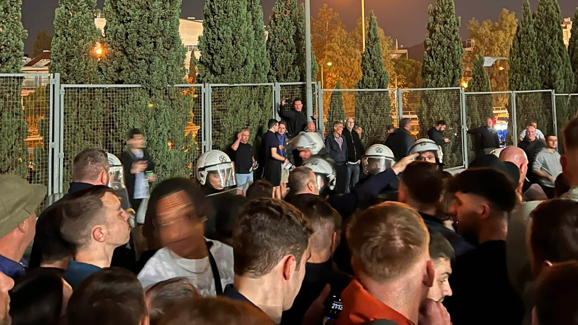 England fans tear gassed & shoved against fences by 'heavy handed' riot cops before Greece clash as FA launch probe