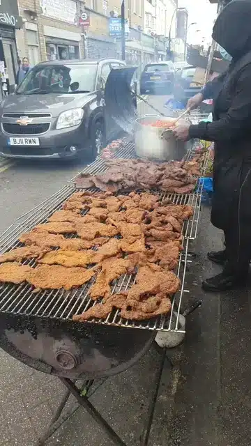 Man celebrates growth, moves roadside 'suya' to big shop in UK