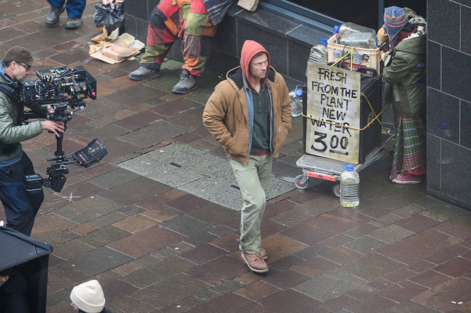 The US star was filmed walking around the corner in the city centre