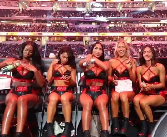 The five ring girls were lathering on oil for the event