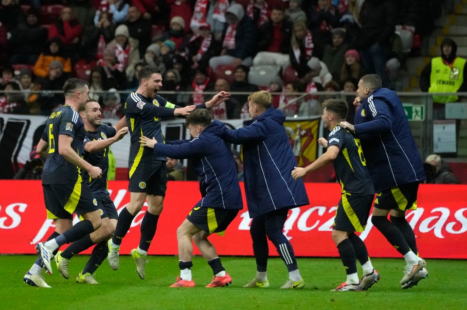 Andy Robertson's late goal in Warsaw put Scotland in third place