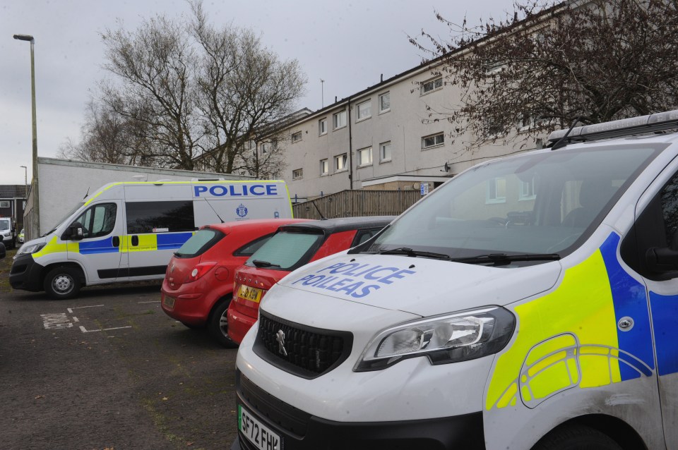 Several police vehicles and officers stood guard in the Lanarkshire town