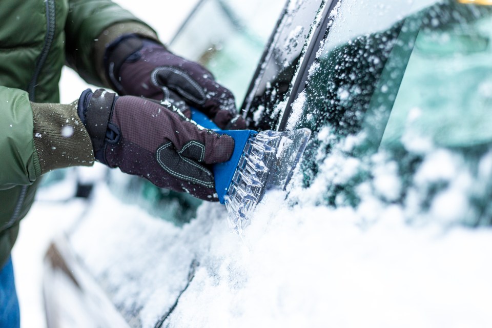 Placing an old blanket on your windscreen is easier than using an ice scraper