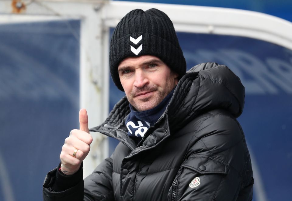 Kilmarnock’s Kyle Lafferty gives a thumb up gesture from the bench at Ibrox