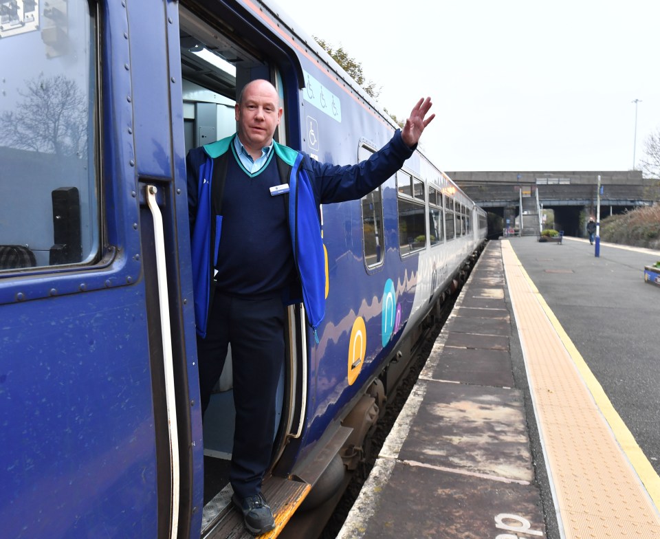 Train guard Darren Scholes gives a wave onboard the 'Denton Flyer'