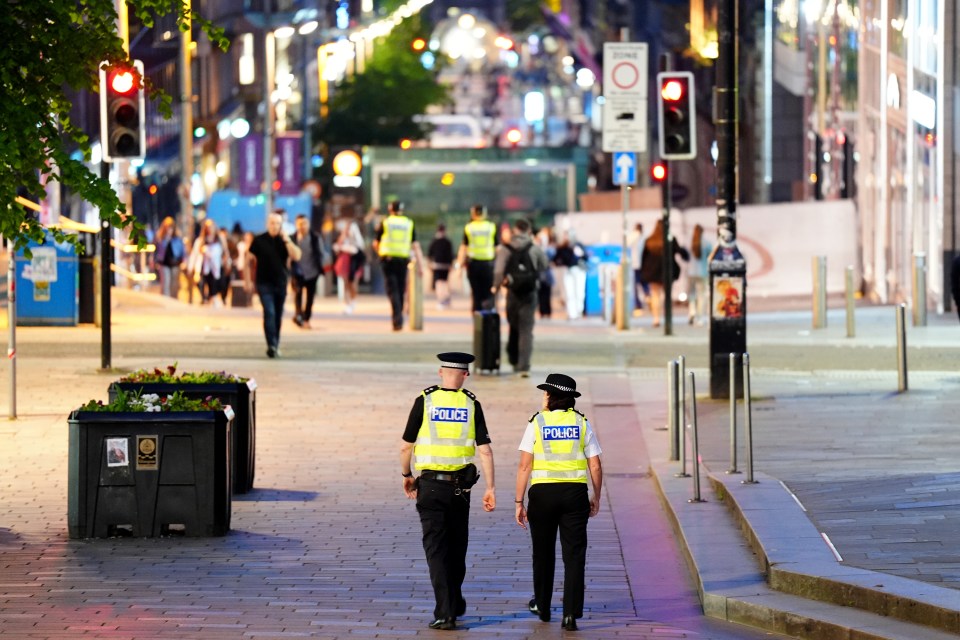 Chief Constable Jo Farrell walks through Glasgow's Buchanan Street with a colleague