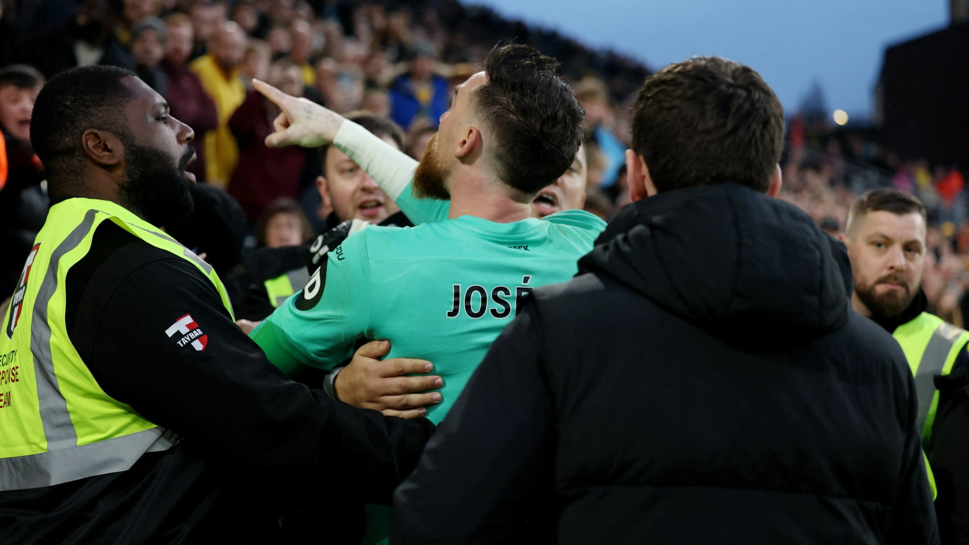 Wolves goalkeeper Jose Sa restrained by security after clashing with his OWN FANS with supporter booted out of stadium