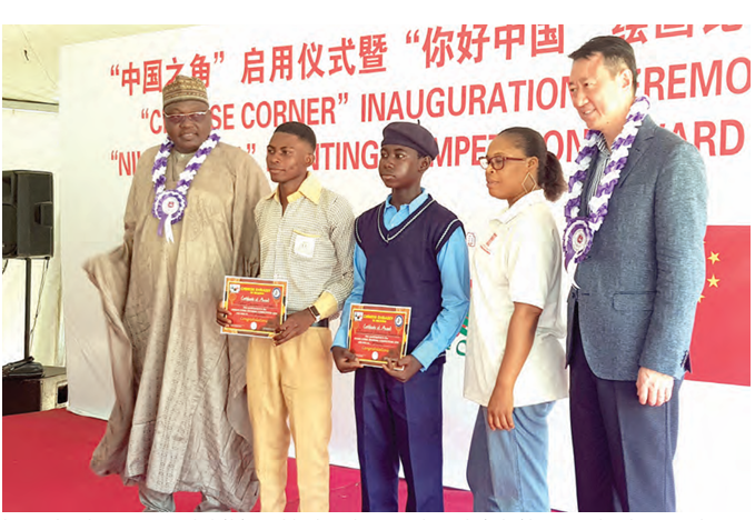 Chinese Ambassador to Nigeria, Yu Dunhai(Fifth from Right) with award winning students and officials of the FCT  Secondary Education Board