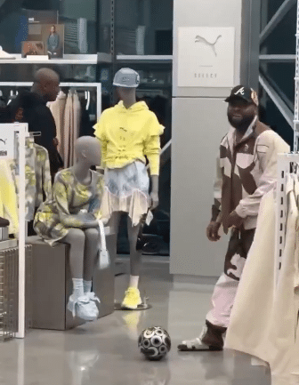 Davido spotted playing football in a clothing store in U.S.