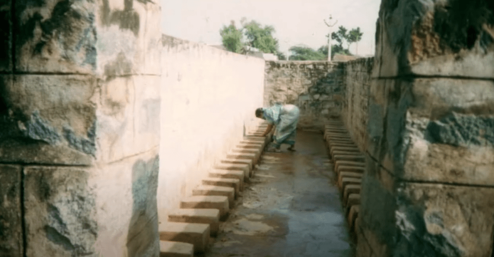 A dry latrine which workers spread sawdust on between users and clean out