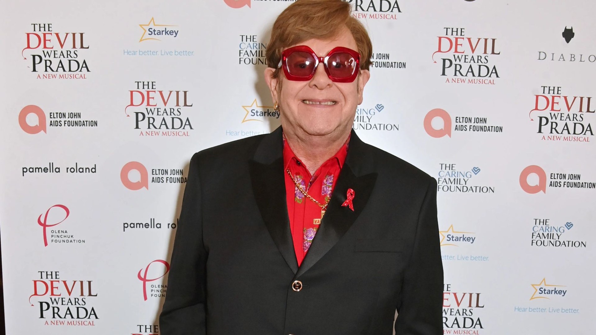 Sir Elton John tells fans 'I've lost my eyesight and cannot see the stage' as he is led out of West End show by husband