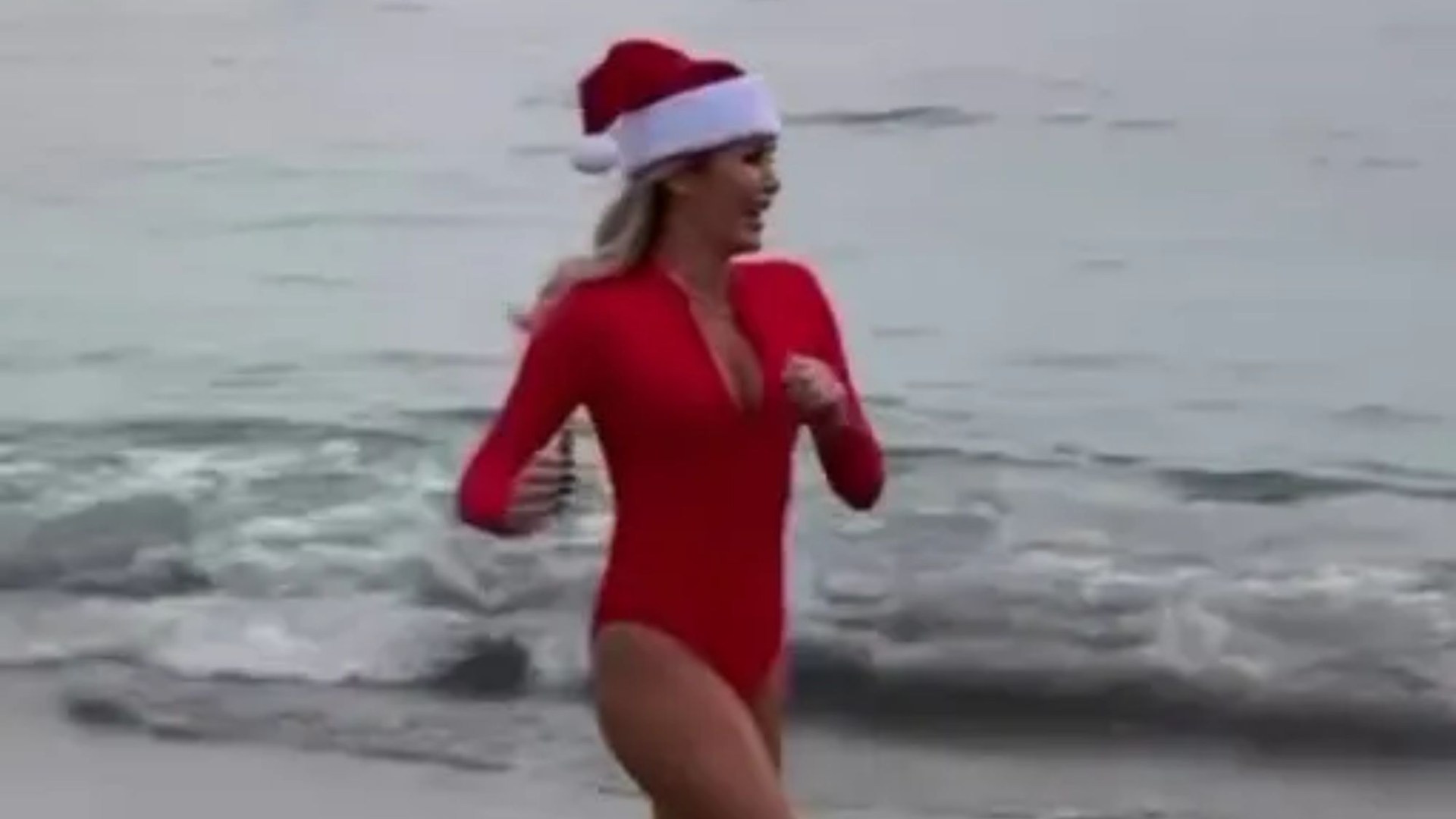 Amanda Holden channels her inner Baywatch babe as she strips off to red swimsuit on freezing beach