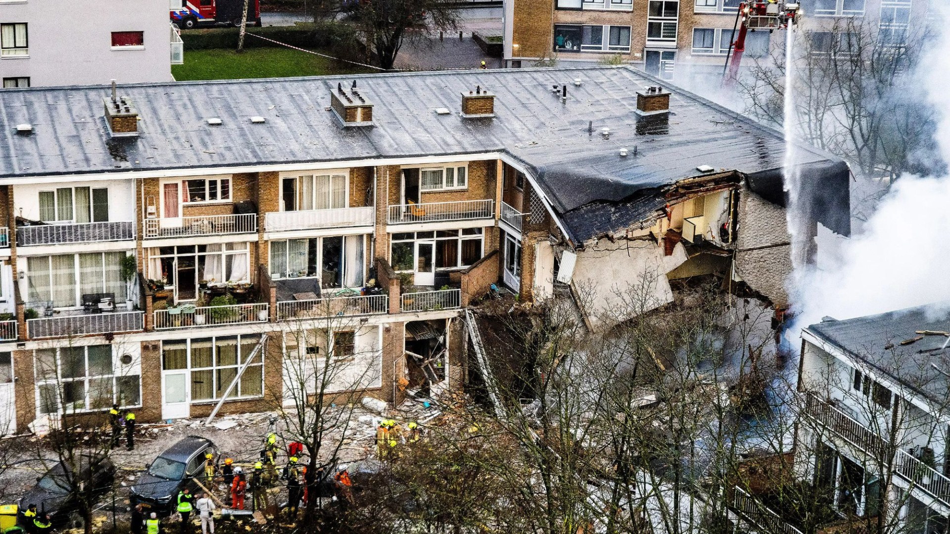 Frantic search for survivors after huge explosion at block of flats in The Hague as cops hunt 'car seen speeding away'