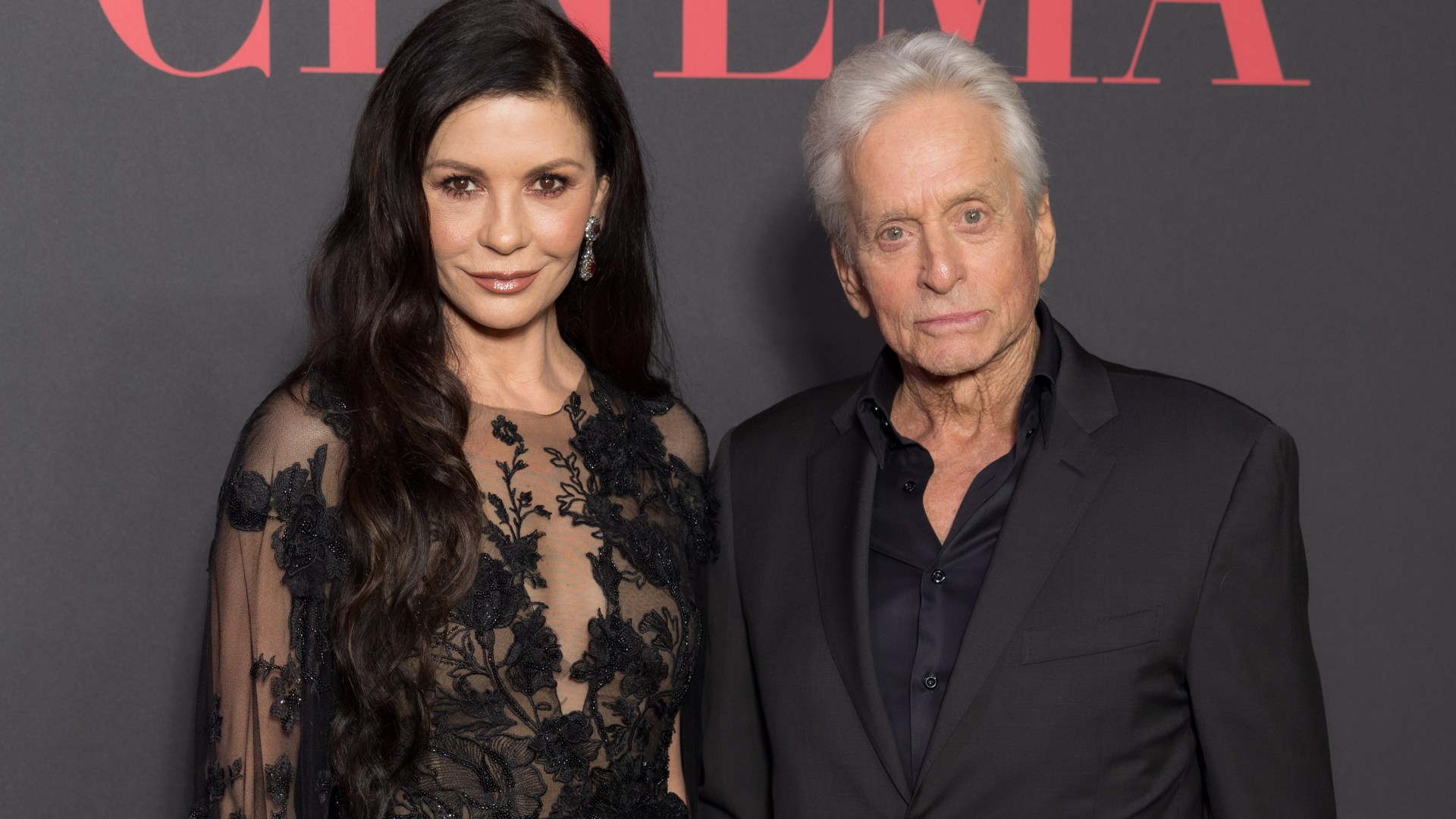 Catherine Zeta Jones, 55, has barley aged in sheer lace dress on the red carpet with husband Michael Douglas, 80