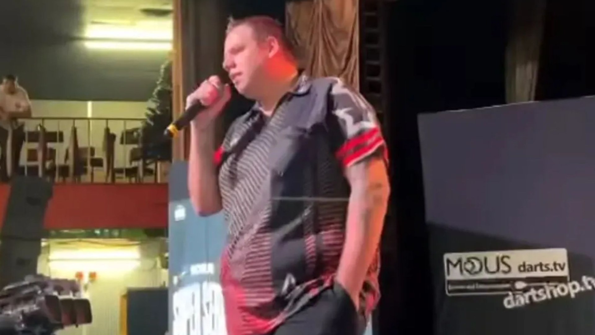 Amazing moment two-time world darts champion surprises fans with Robbie Williams rendition on stage