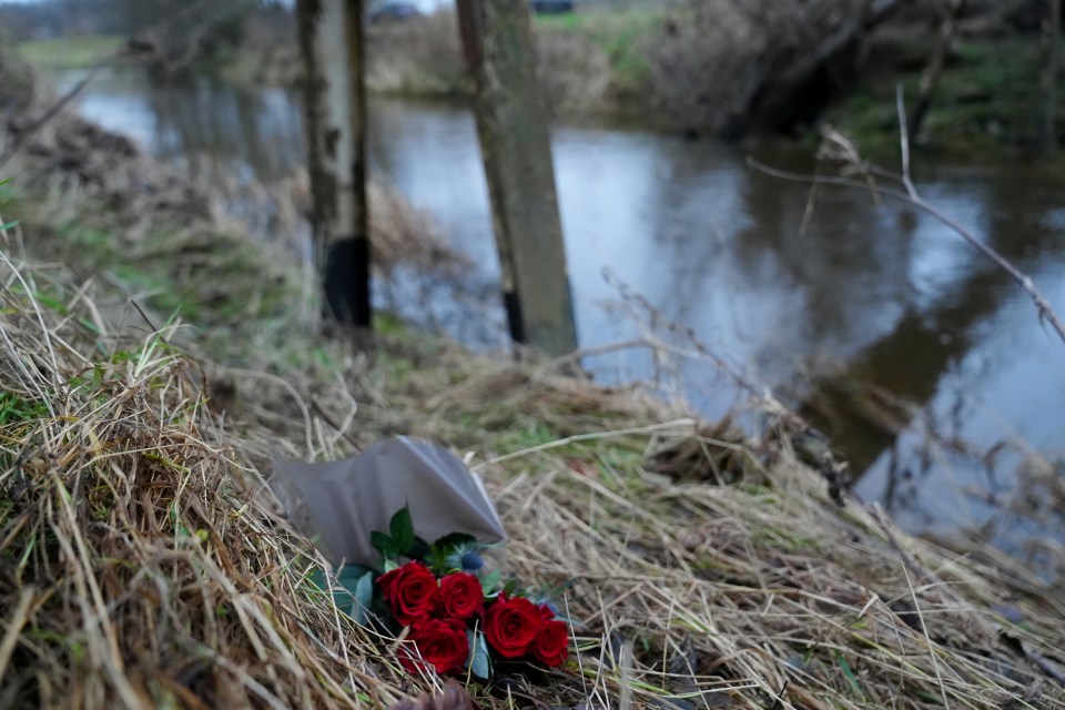 Floral tributes on the river bank