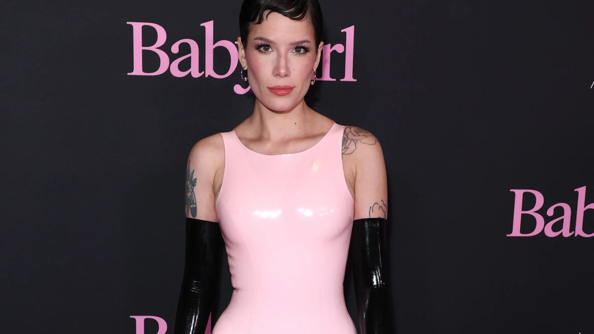 Halsey stuns in pink latex dress and knee high socks at premiere of Nicole Kidman's steamy new movie