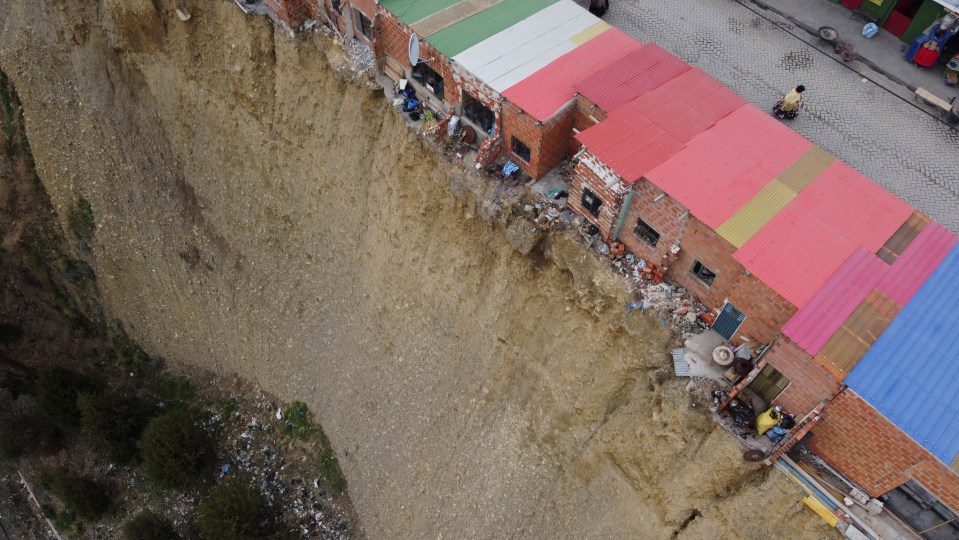 The homes are built on the edge of an earth cliff