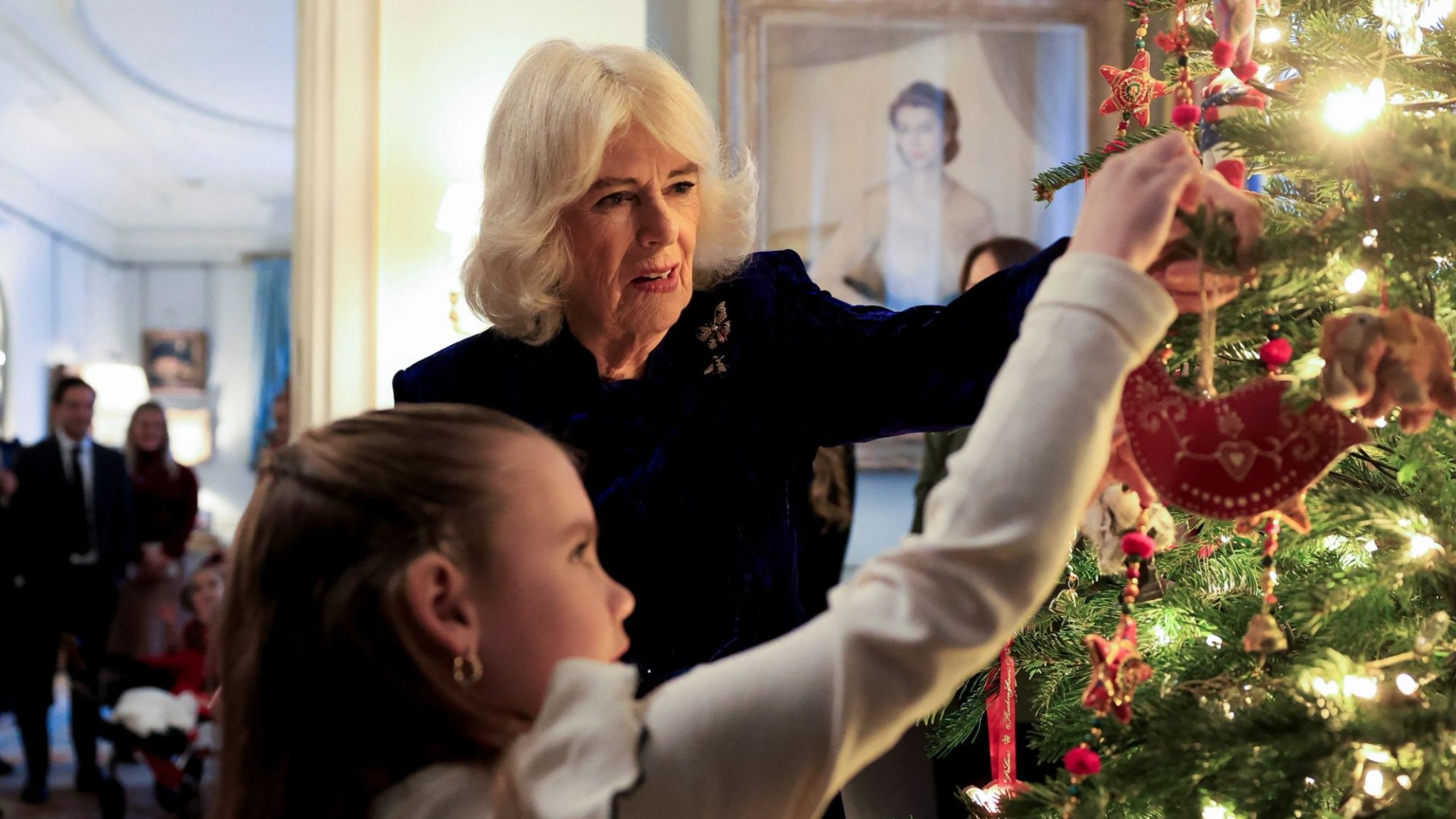 Queen Camilla decorates Christmas tree with terminally ill youngsters as she treats them to morning of festive fun