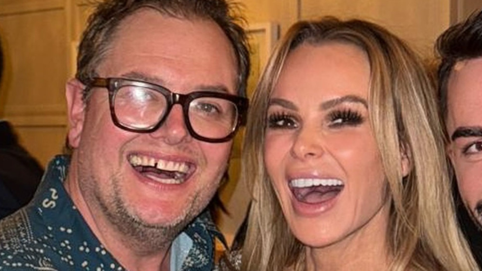 Amanda Holden flashes her legs in short dress as fans tell her she ‘looks 21’ at boozy Christmas bash with pal Alan Carr