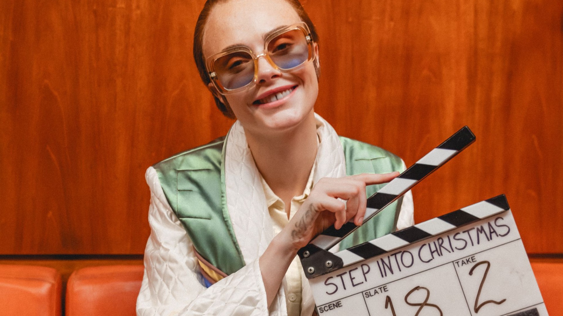 Huge Brit supermodel transforms into Elton John for new Step Into Christmas music vid - can you tell who?