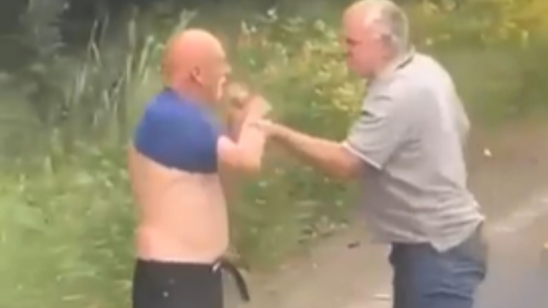 Shock moment school bus driver punches road rage yob - as gawping pupils watch furious brawl erupt