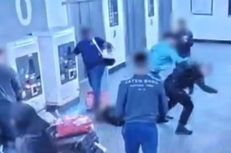 Further footage appeared to show a fight between the police officers and three men