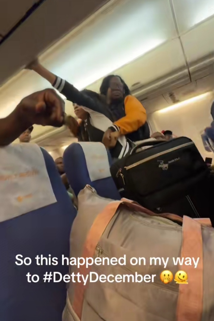 Two women clash on plane over overhead bin, video trends