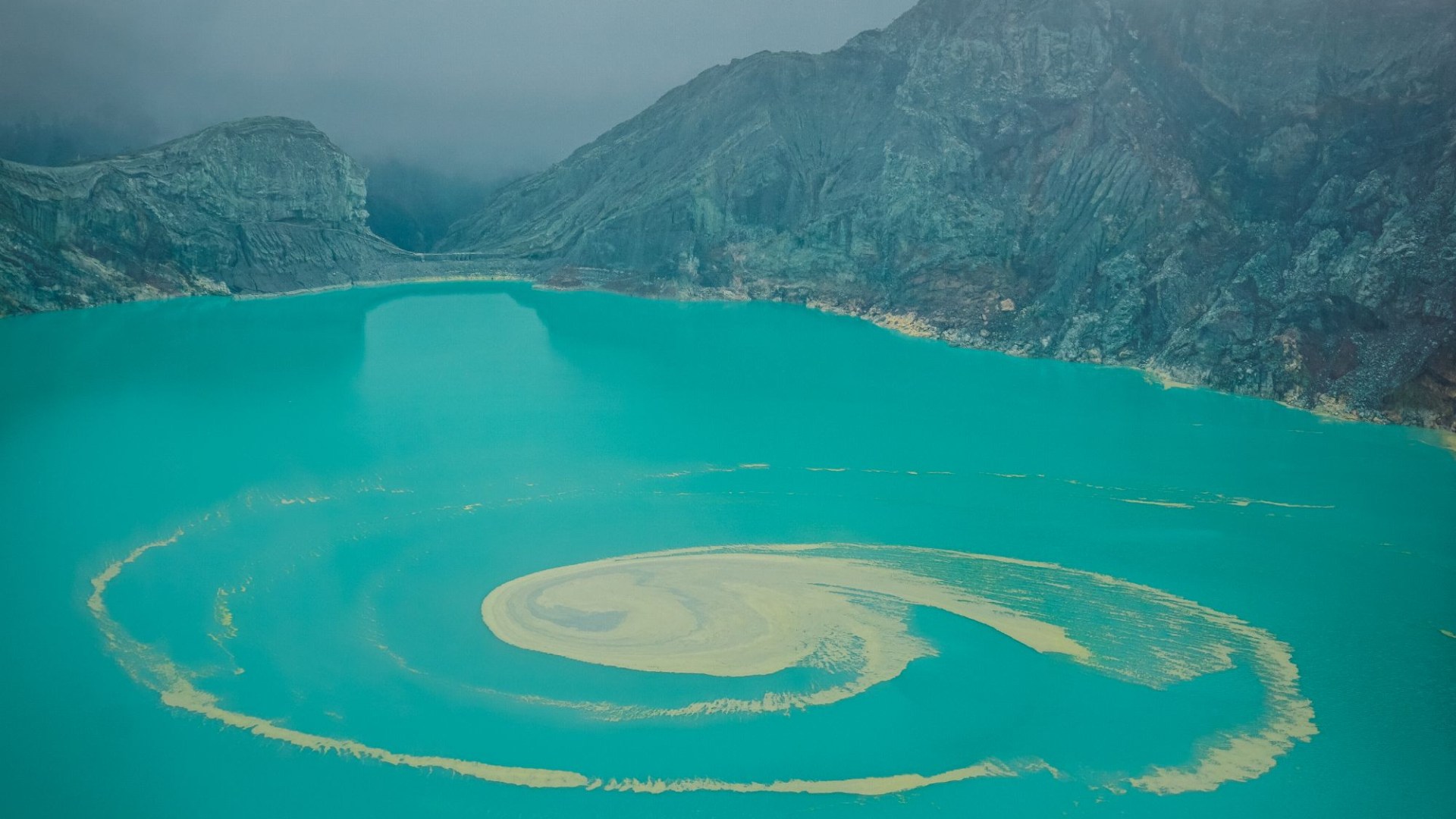 Inside volcano with world's largest ACID lake that melts skin & spews blue lava