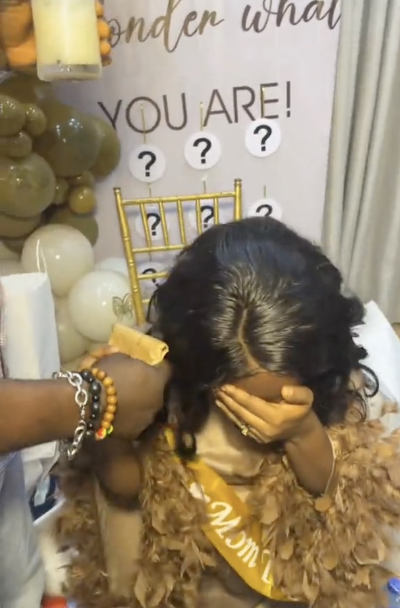 Woman weeps as boss holds surprise baby shower for her