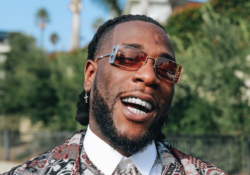 Video of Burna Boy begging Cubana Chief Priest for cake resurfaces online